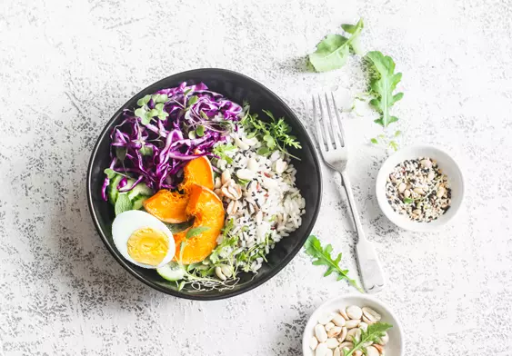 Healthy bowl of food on the counter with a fork