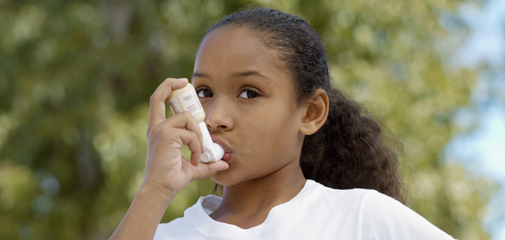 ChildhoodAsthma_GirlUsingInhaler.jpg